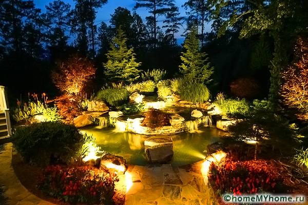 Illumination at night allows you to create a fabulous place from an ordinary rock garden