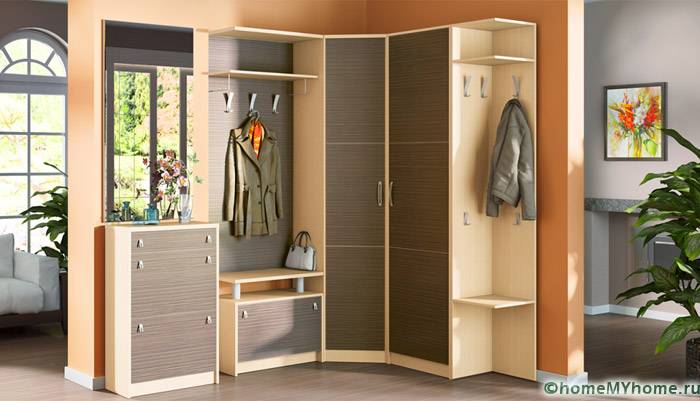 The corner wardrobe is complemented by a cabinet and open hangers