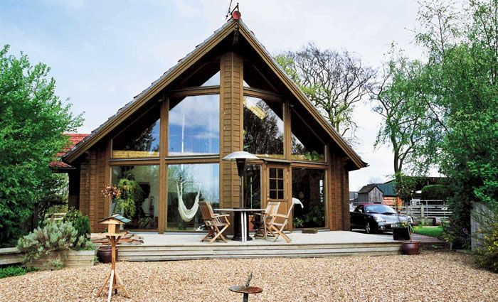 Ако къщата първоначално е била планирана в скандинавски стил, както е на снимката, тя трябва да има огромни прозорци с минимум прегради