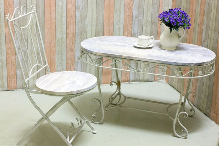 Metal furniture, painted white, looks light and does not weigh down the room
