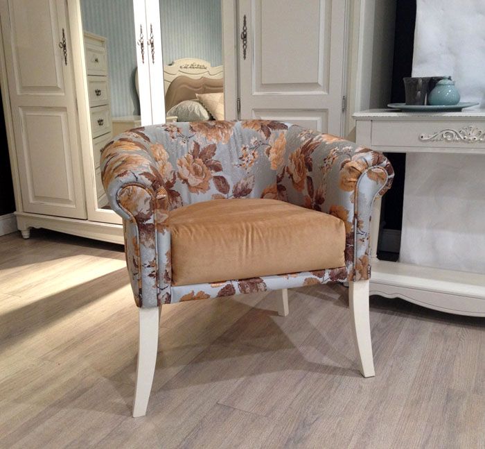 Chairs with low backs have proven themselves well for living rooms both as a piece of furniture and as an element of decor