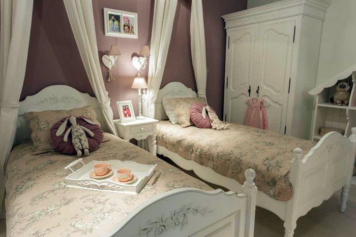 Wooden beds are decorated with decoupage and drawings with an obligatory floral pattern