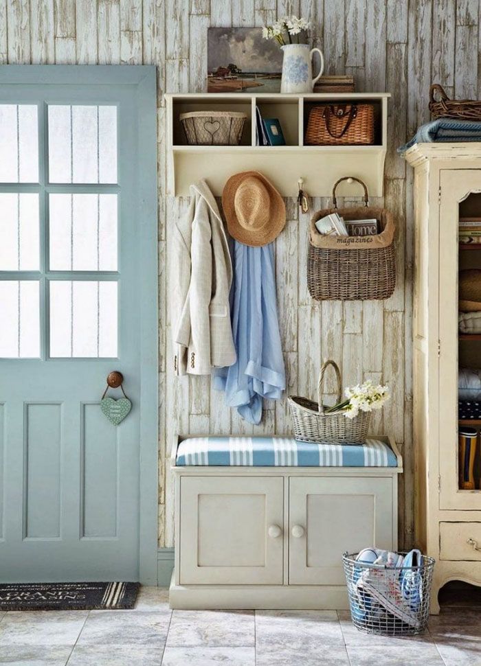 Do not clutter up the space of a small hallway. Everything here is essentially: a bench, a hanger, a wardrobe and a shelf. Scuffs on a light wood background look natural