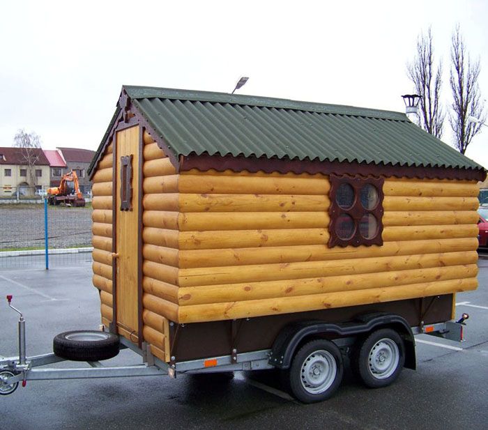 Frame sauna, placed on a biaxial trailer, sheathed with a block house