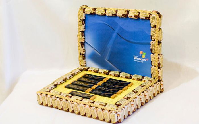 The edges of the laptop are decorated with tape