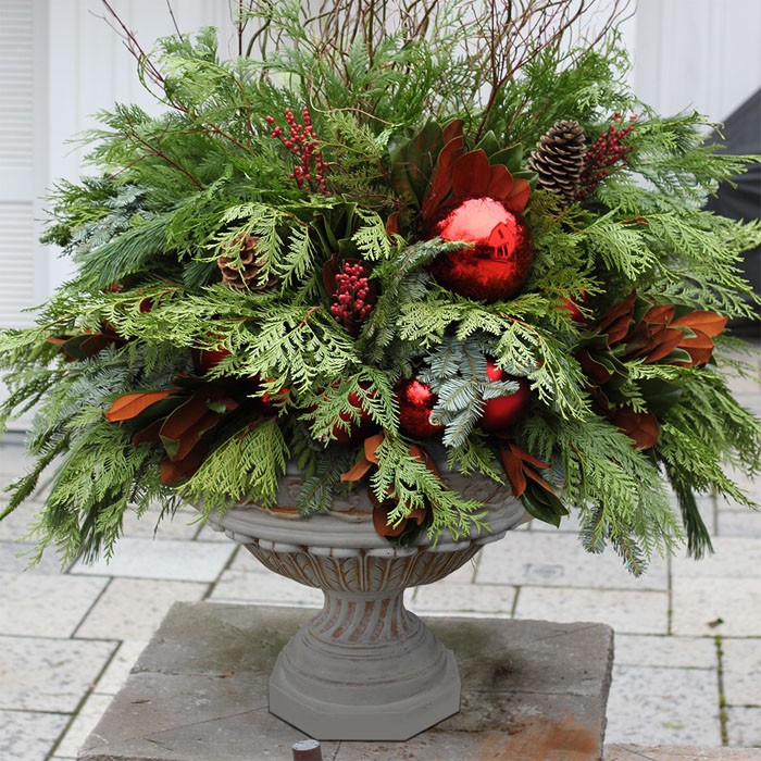 The bouquet is collected from coniferous branches: thuja, cedar, pine, spruce. If desired, it is decorated with Christmas decorations, snowflakes and stars.