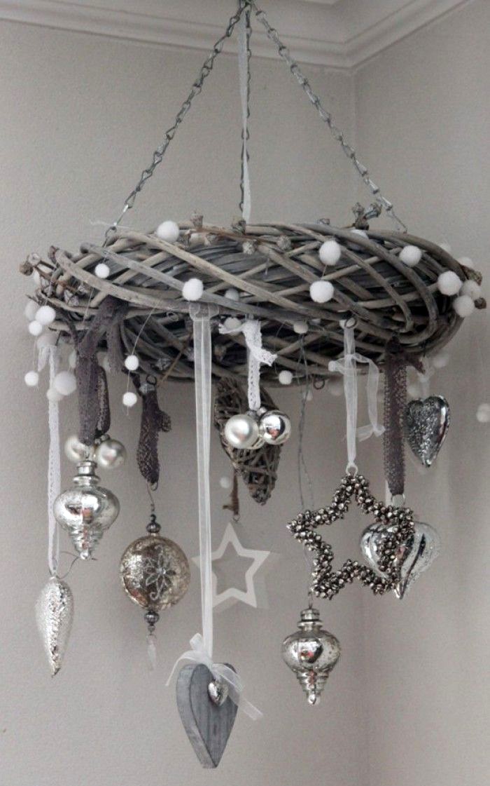 To make such a miracle, you need to prepare vines or willow vines. The vines are soaked and twisted into a wreath, fixed and allowed to dry again. Any decor is suitable for such a horizontal wreath.