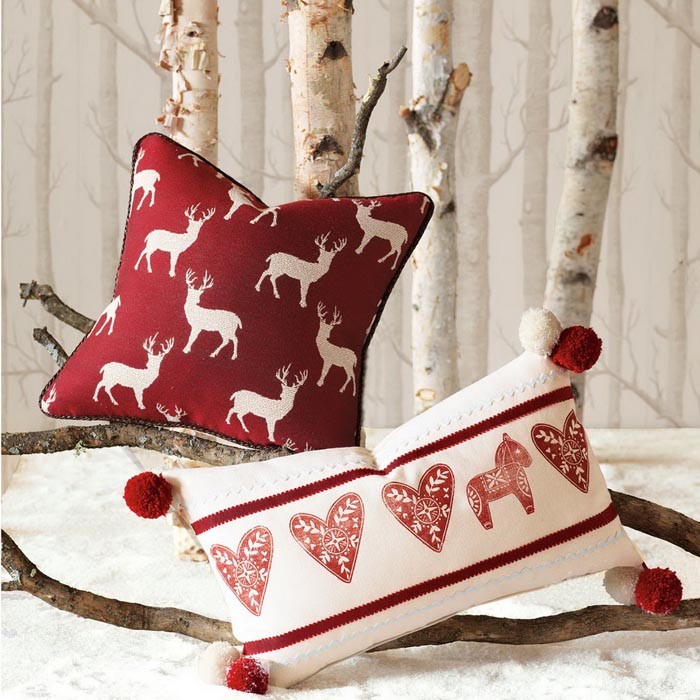 Woolen pillows and bedspreads, furs - a winter version with a thematic ornament becomes a background design for decoration