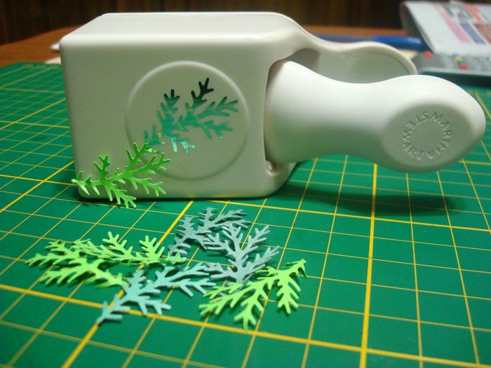 An example of a figured hole punch in the form of spruce twigs