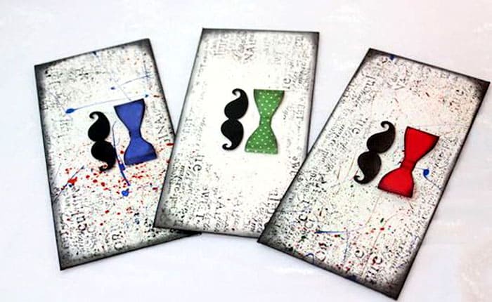 Modelele masculine sunt, de asemenea, concepute creativ: marginile sunt tratate cu un burete ușor înmuiat în guașă. Ar fi frumos să plasați un detaliu tematic în centru, așa cum se spune, fără bibelouri