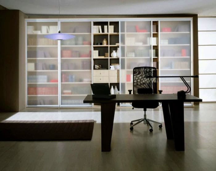 Built-in glass bookcase attaches to the walls via side or rear panels. For reliability, the structure is also attached to the ceiling or floor.