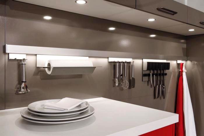 Towel racks and dryers are located close to the sink